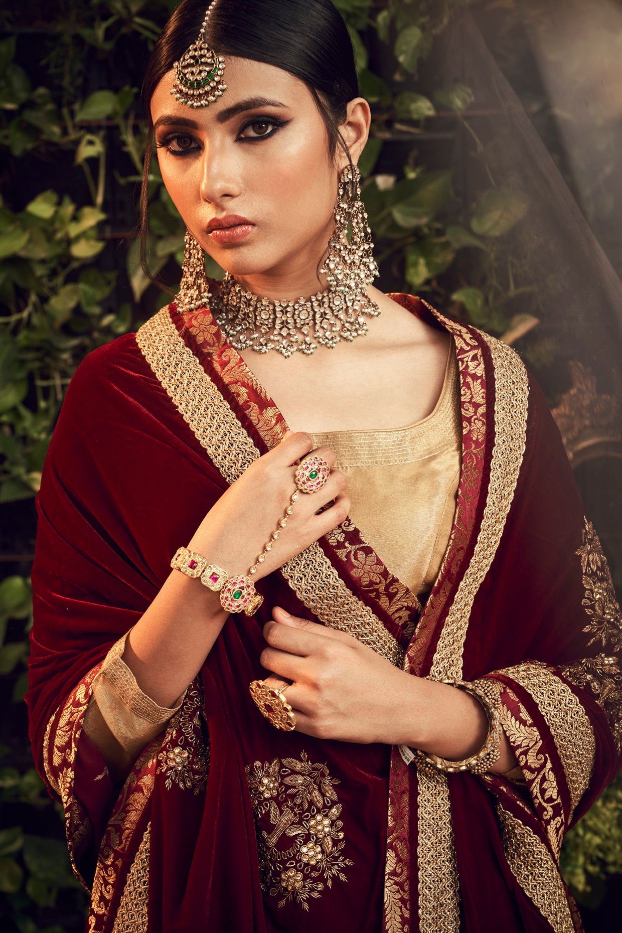 Photo of Gorgeous bride wearing maroon blouse with polki and emeralds  jewelry